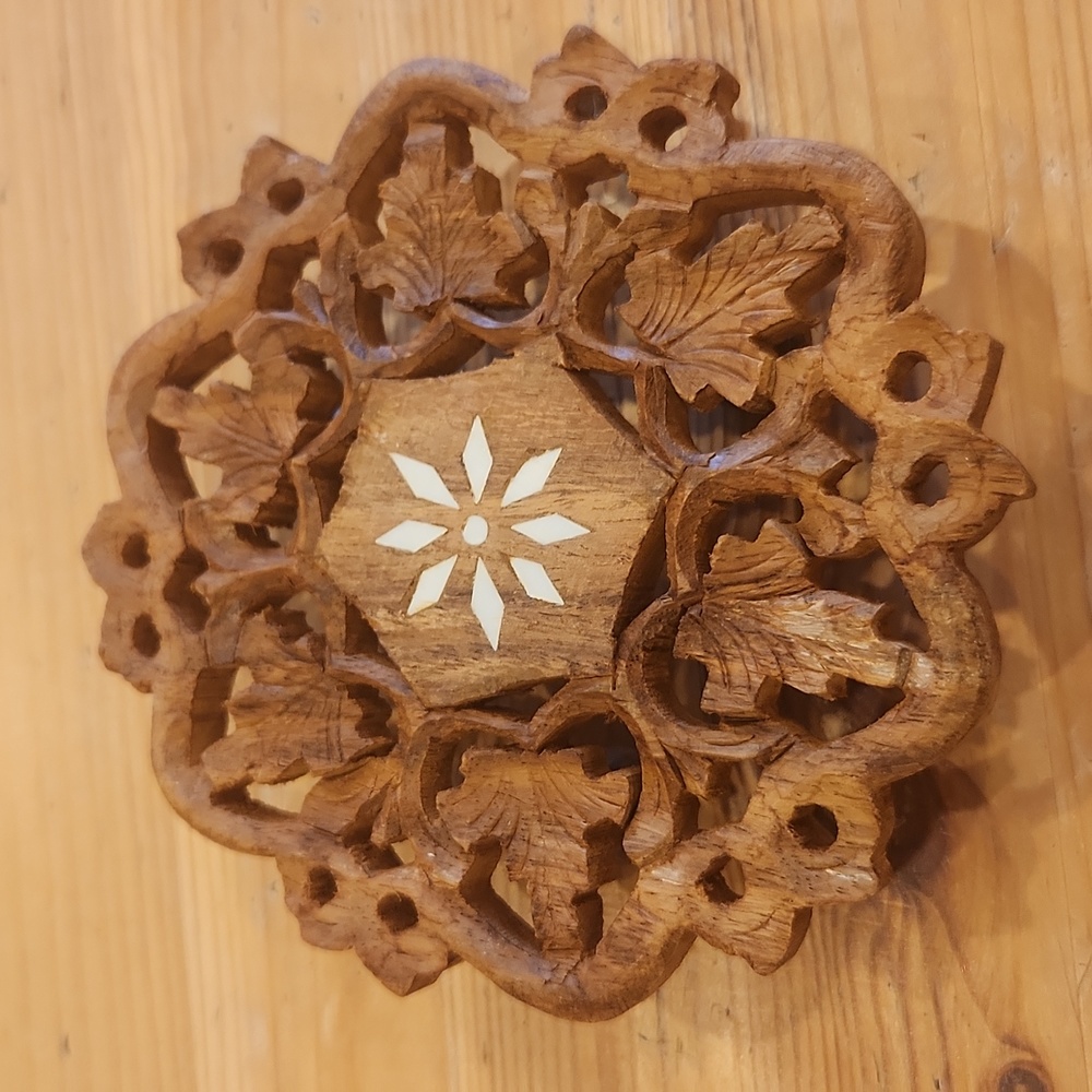 Round wooden carved trivet